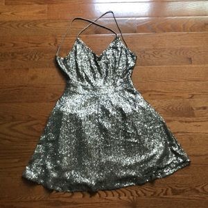 Gold sequined skater dress with open back